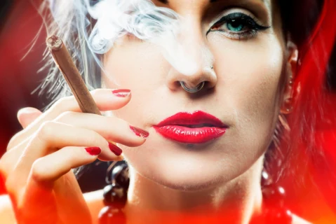 Beauty portrait with red lipstick and drifting smoke.