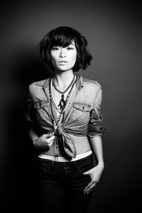 Studio portrait with denim clothing and directional light.