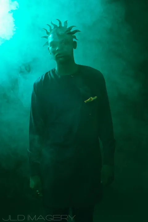 Atmospheric portrait submerged in green-blue water.